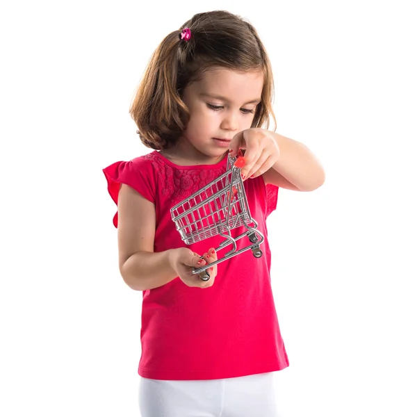 Girl playing with mini supermaeket cart — Stock Photo, Image