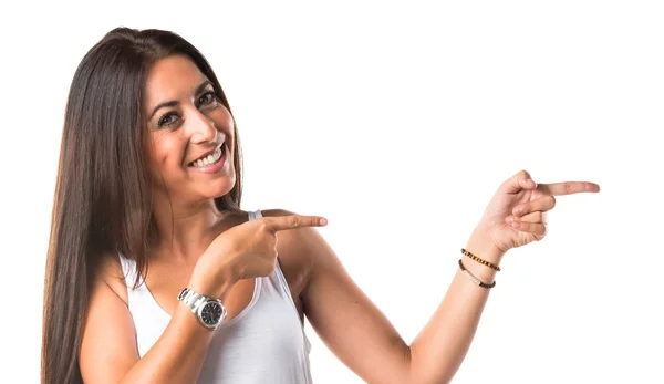 Mujer señalando hacia el lateral — Foto de Stock