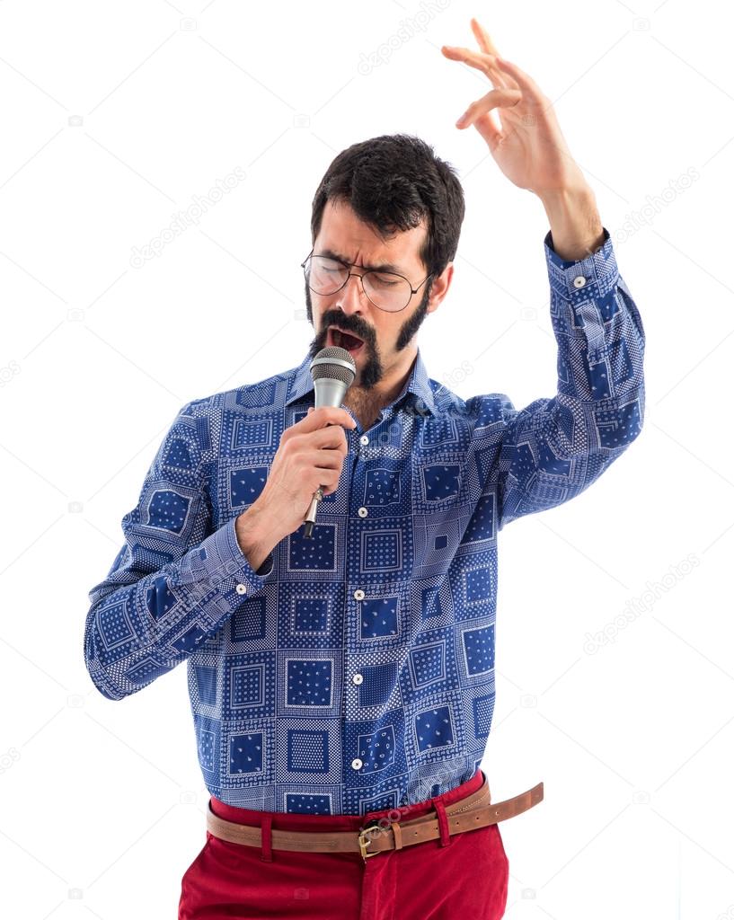 Vintage young man singing with microphone