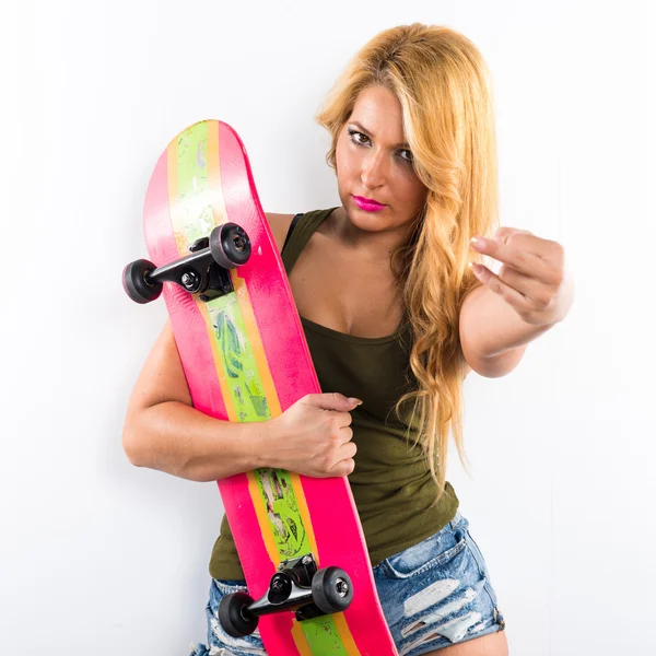 Skateboarder girl over white background — Stock Photo, Image