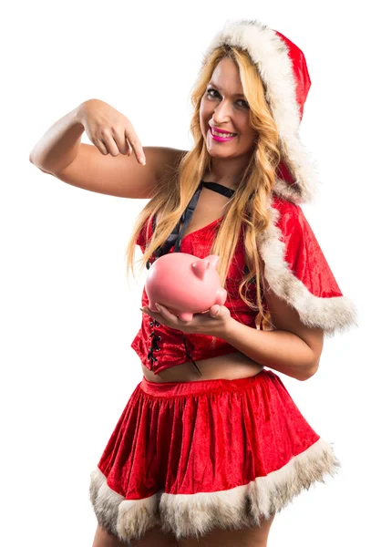 Mulher de Natal segurando um mealheiro — Fotografia de Stock