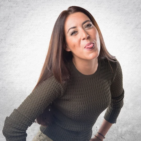 Woman taking out her tongue — Stock Photo, Image