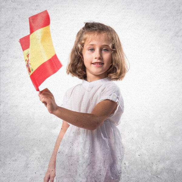 Kid holding a spanish flag