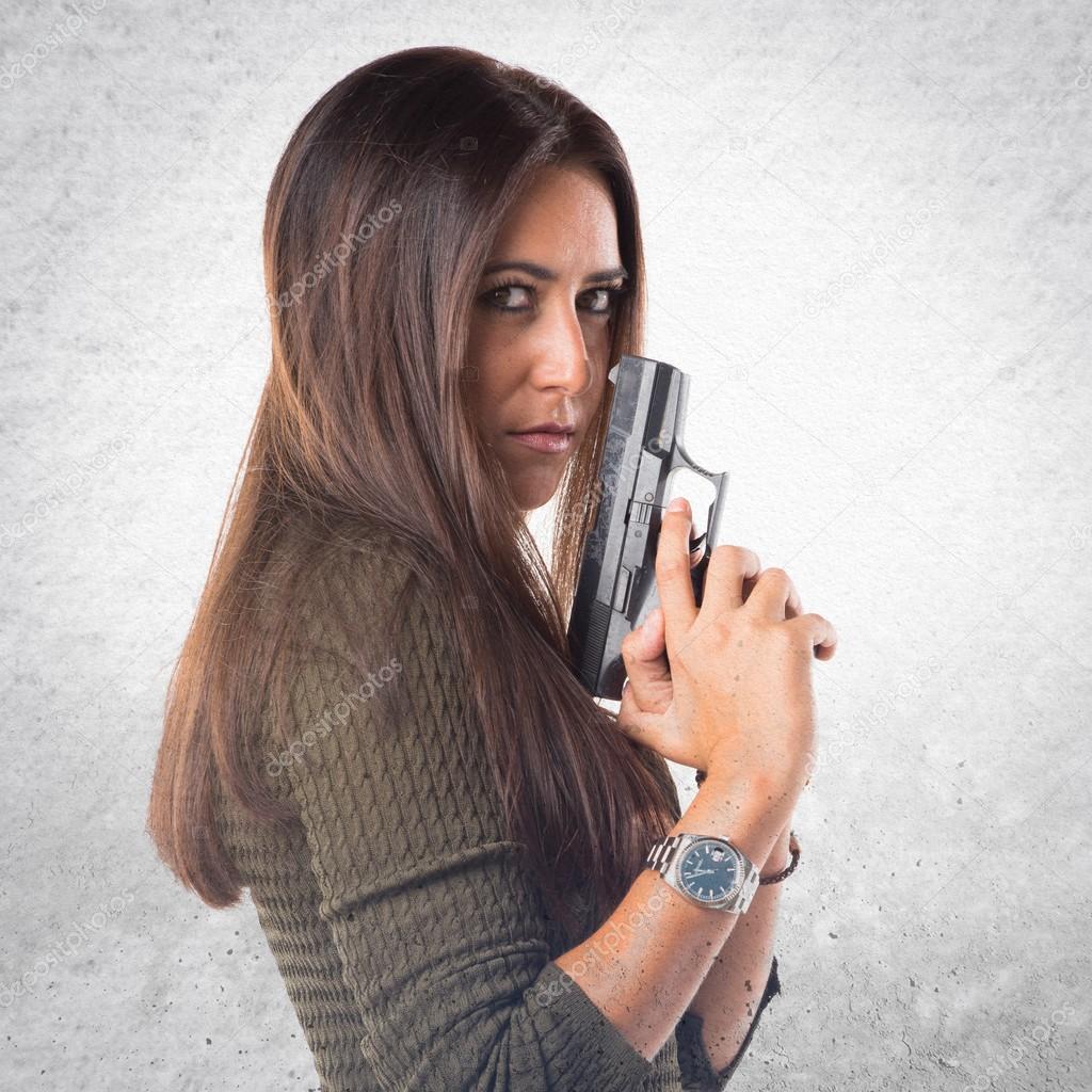 Woman holding a pistol