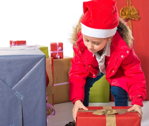 Little girl with several presents — Stock Photo, Image