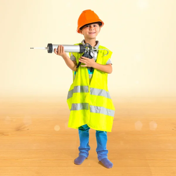 Kind wie Arbeiter gekleidet — Stockfoto