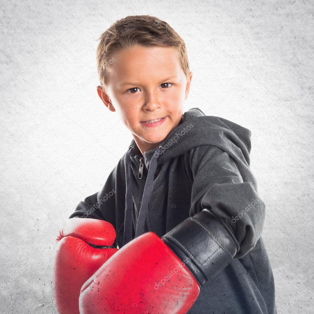 Kid with boxing gloves