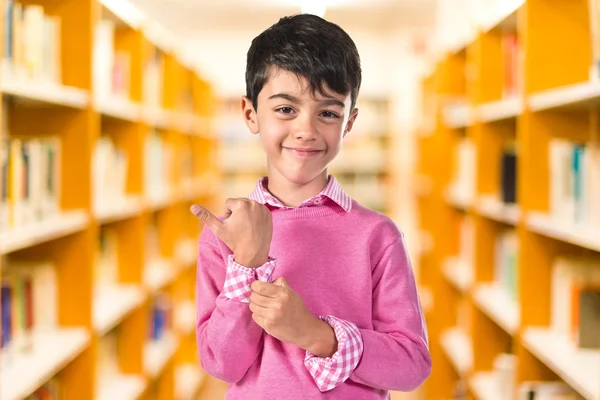 Portratit of young boy with pink sweater — Stock Photo, Image