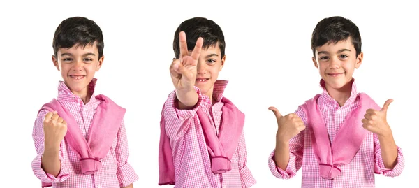 Child doing victory gesture — Stock Photo, Image