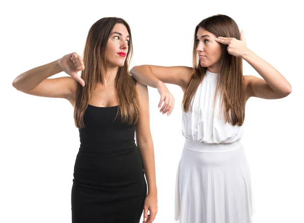 Twin sisters making bad gesture — Stock Photo, Image