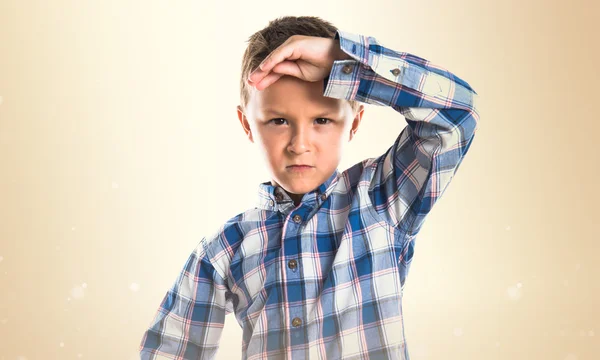 Kid over ocher background — Stock Photo, Image