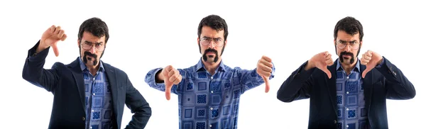 Vintage young man doing bad signal — Stock Photo, Image