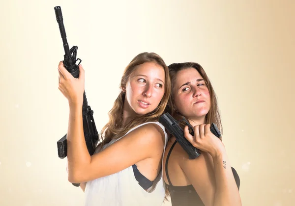 Friends holding a SMG and a gun — Stock Photo, Image