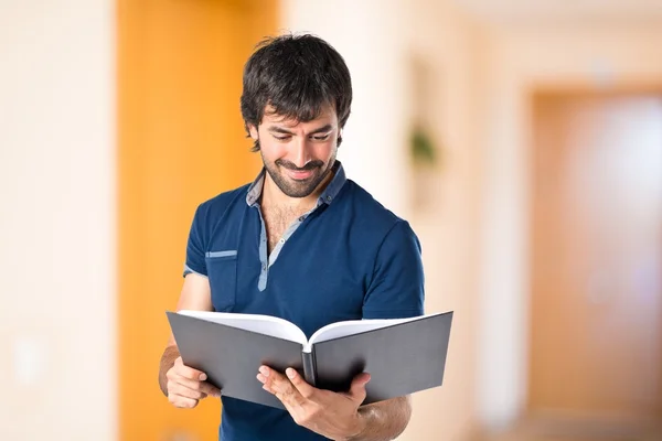 Man reading a book over white background — Stock Photo, Image