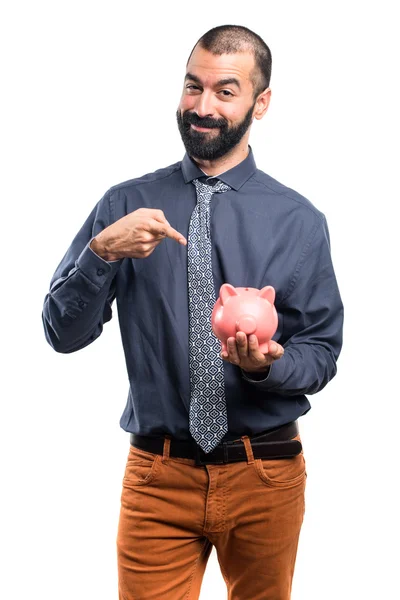 Uomo che tiene un salvadanaio — Foto Stock