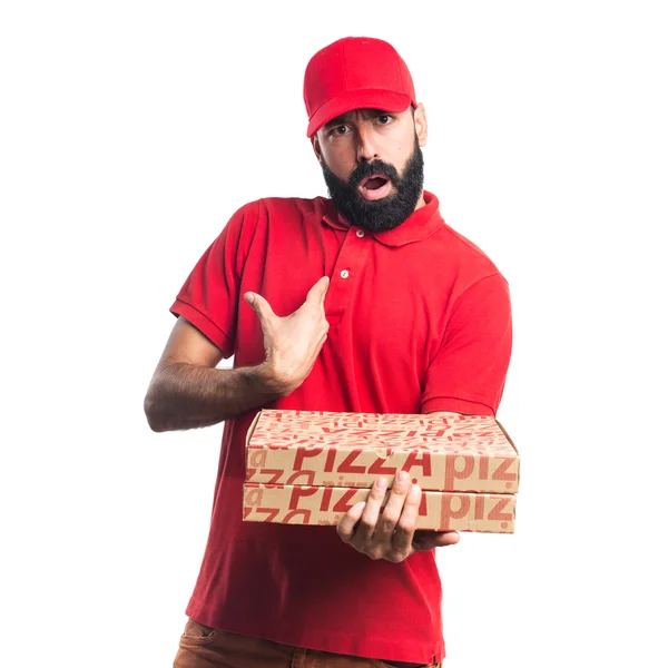 Pizza levering man doen verrassing gebaar — Stockfoto