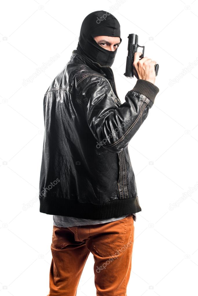 Robber shooting with a pistol