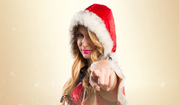 Christmas woman pointing to the front — Stock Photo, Image