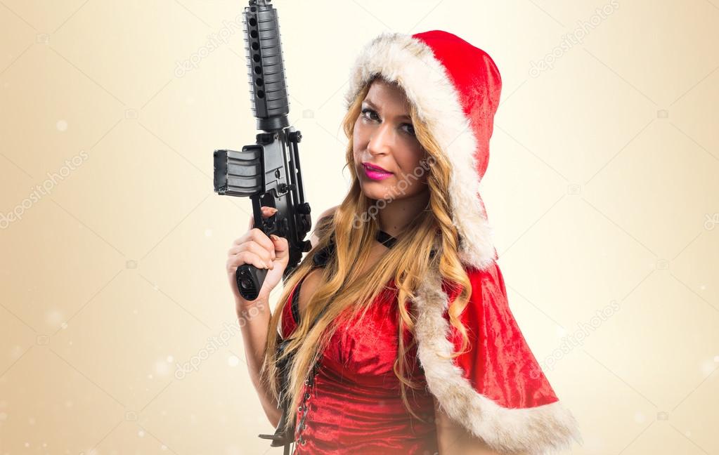 Christmas woman holding a pistol