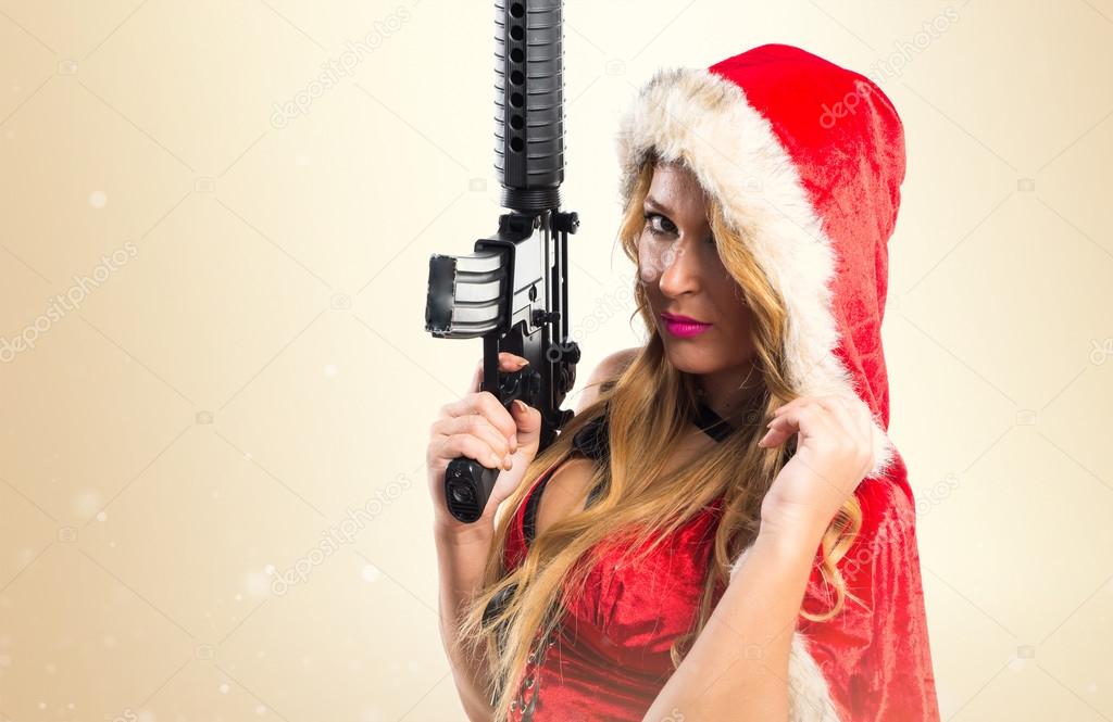 Christmas woman holding a pistol