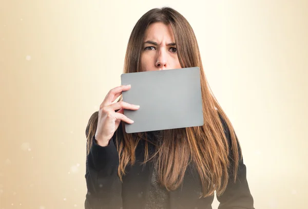 Girl holding an empty placard — Stock Photo, Image