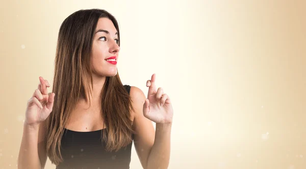 Girl with her fingers crossing — Stock Photo, Image