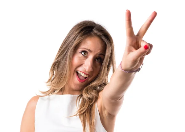 Woman doing victory gesture — Stock Photo, Image