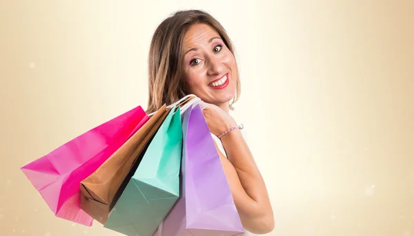 Mujer con muchas bolsas de compras — Foto de Stock