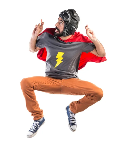 Superbohater z jego palce przekraczania — Zdjęcie stockowe