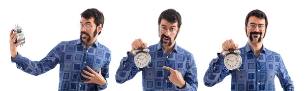 Uomo sorpreso in possesso di orologio vintage — Foto Stock