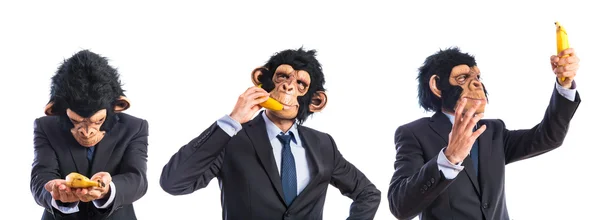 Ape man speaking through a banana — Stock Photo, Image