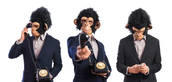 Monkey man talar till vintage telefon — Stockfoto