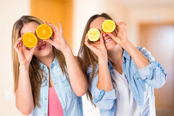 Friends playing with fruits over white background — Stock Photo, Image