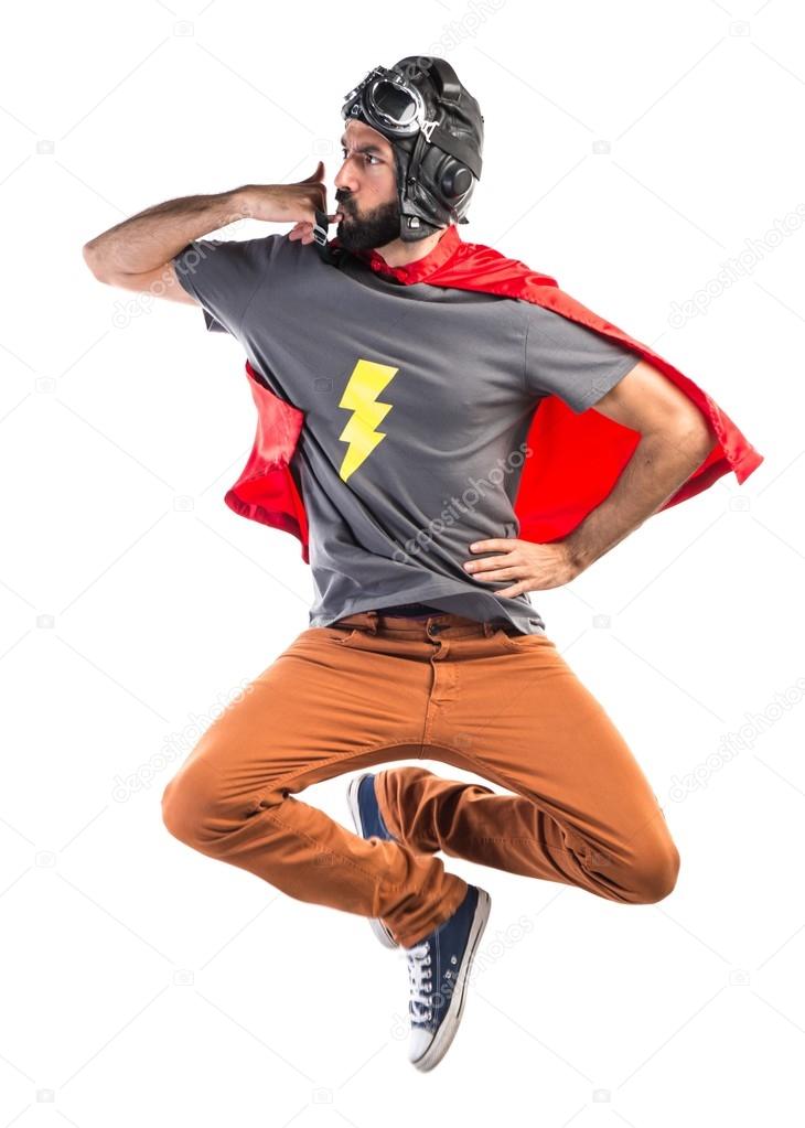 Superhero making phone gesture