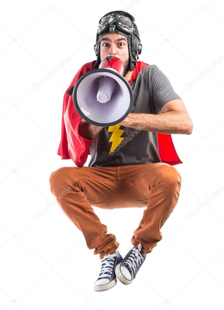 Superhero shouting by megaphone