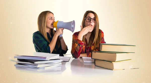 Students shouting by megaphone — Stock Photo, Image