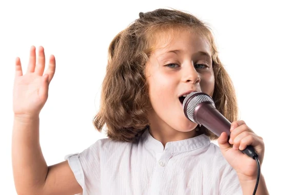 Girl singing with microphone — Stock Photo, Image