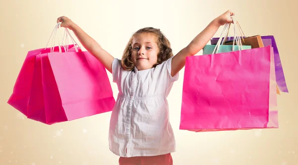 Menina com muitos sacos de compras — Fotografia de Stock