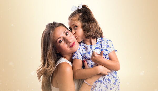 daughter kissing her mother