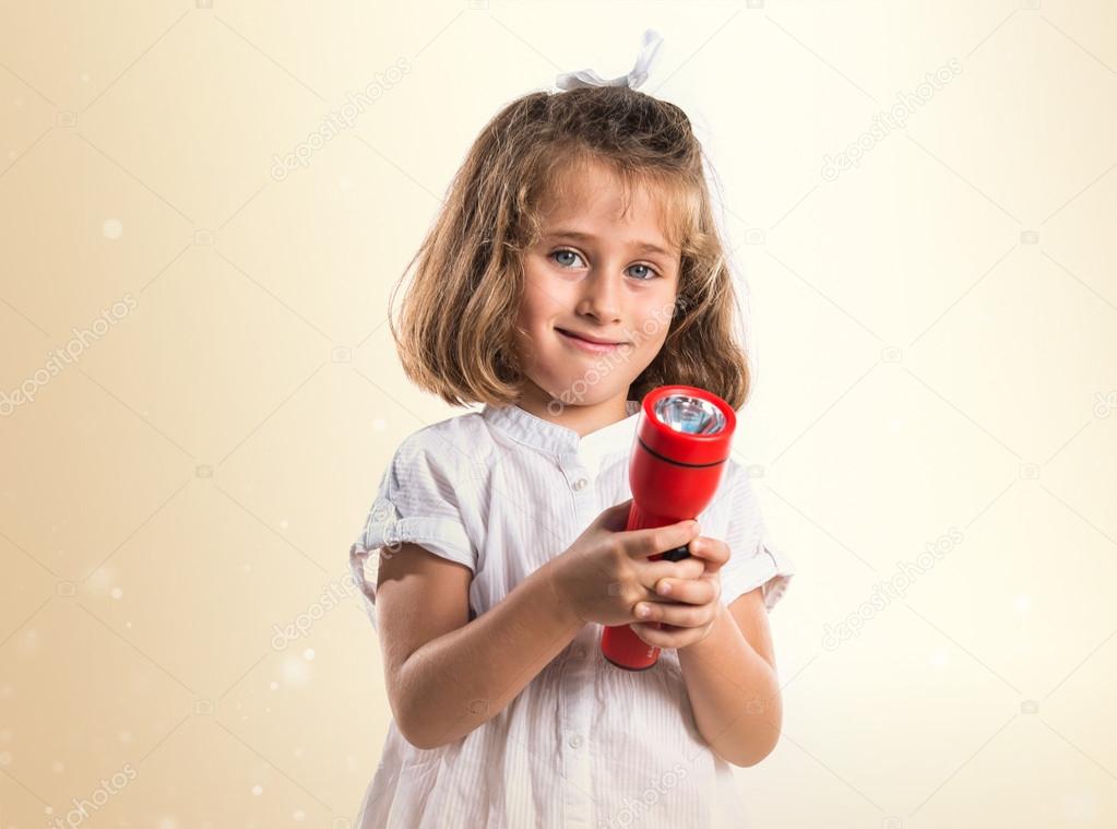 Featured image of post Kid Holding Flashlight - Besides, it has the dora the explorer flashlight has a perfect light with fine brightness, which will help your kid not to be.