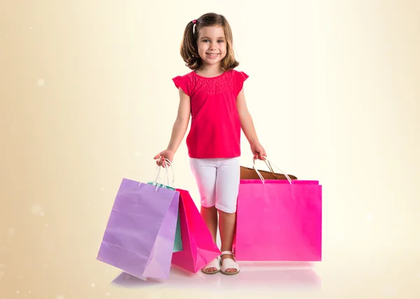 Chica con muchas bolsas de compras —  Fotos de Stock