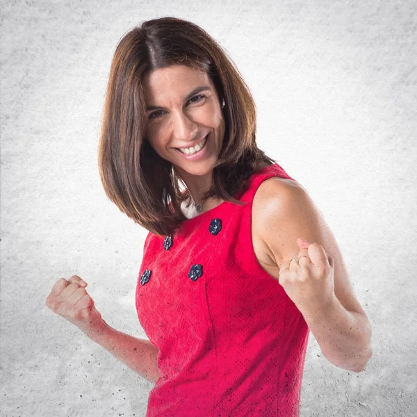 Brunette woman over textured background — Stock Photo, Image