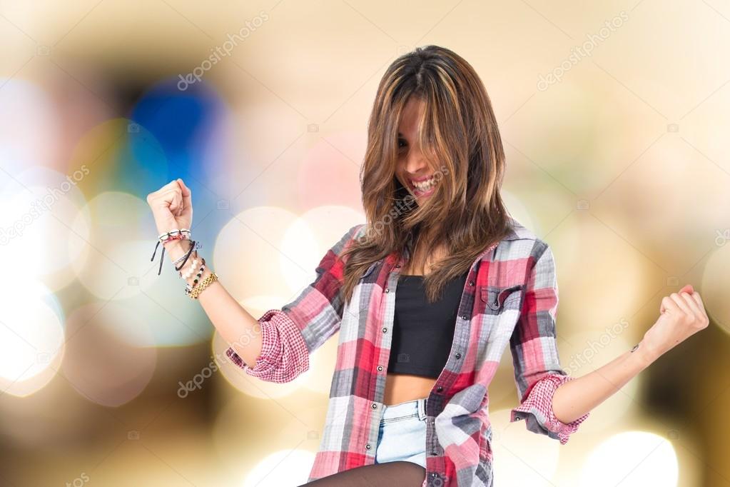 Lucky young girl over isolated white background