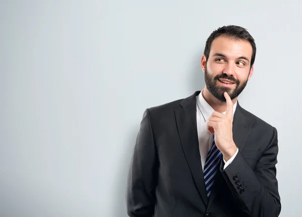 Zakenman denken op witte achtergrond — Stockfoto