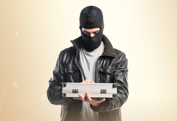 Robber holding a briefcase