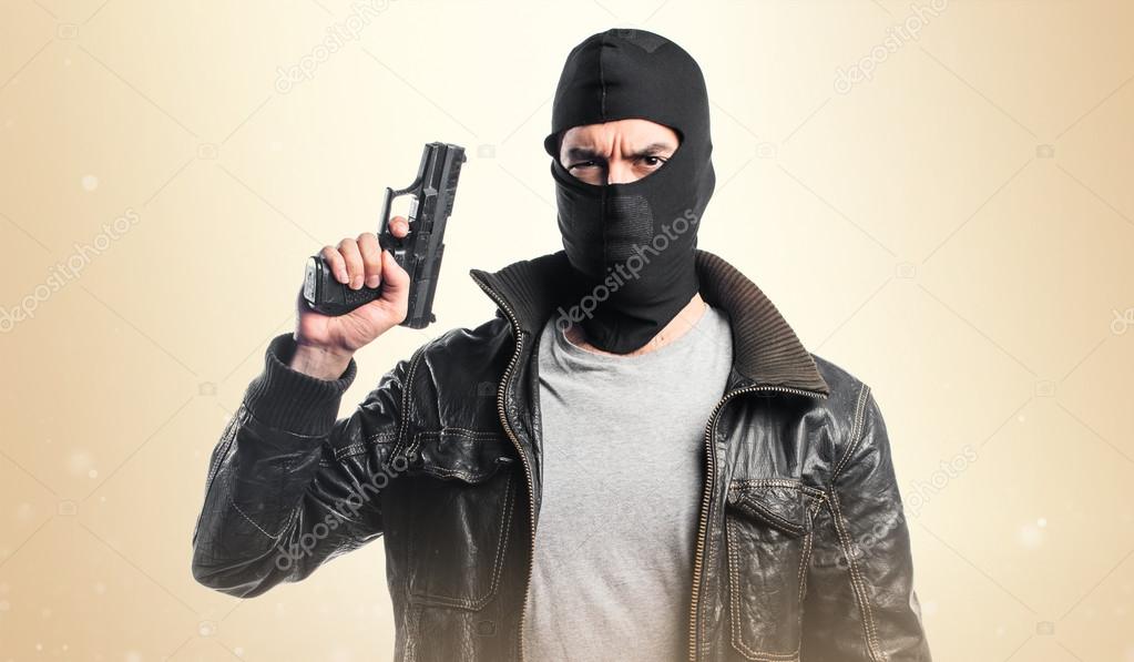 Robber shooting with a pistol