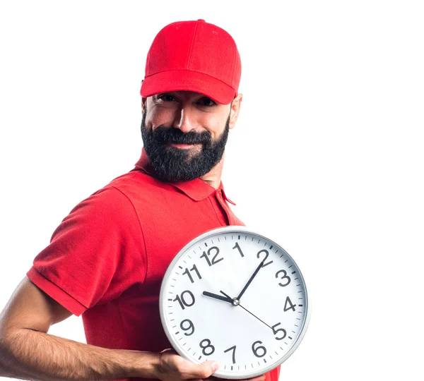 Pizza delivery man holding vintage clock — Stock Photo, Image