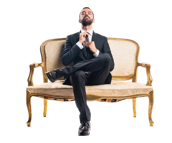 Businessman sitting on armchair — Stock Photo, Image