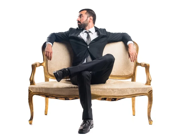 Businessman sitting on armchair — Stock Photo, Image