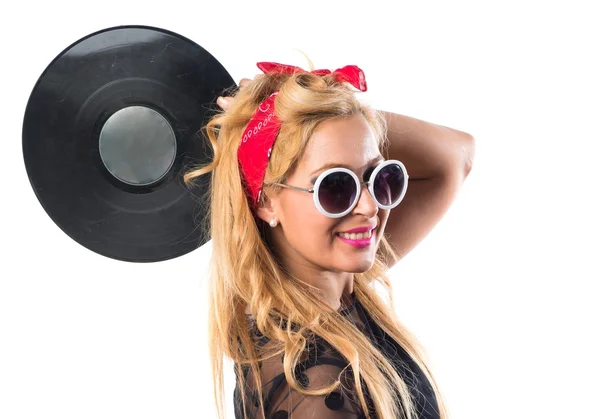 Pin-up girl innehar en vinyl — Stockfoto